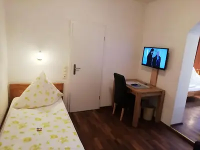 Ein Bett oder Betten in einem Zimmer der Unterkunft Isenburger Hof