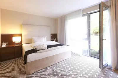 Ein Bett oder Betten in einem Zimmer der Unterkunft SeeHotel Ketsch