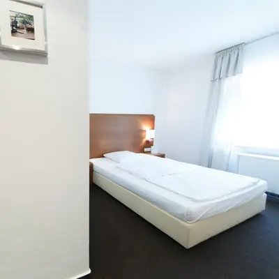Ein Bett oder Betten in einem Zimmer der Unterkunft SeeHotel Ketsch