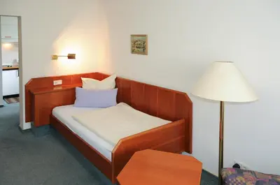 Ein Bett oder Betten in einem Zimmer der Unterkunft Alfa Apartment Hotel