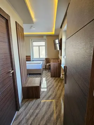 Ein Bett oder Betten in einem Zimmer der Unterkunft Hotel City Faber