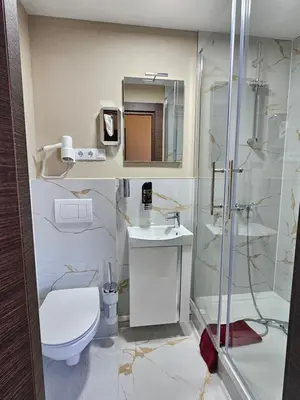 Ein Badezimmer in der Unterkunft Hotel City Faber