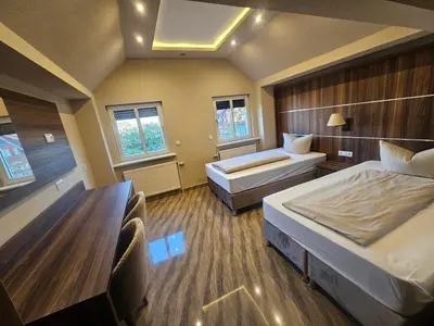 Ein Bett oder Betten in einem Zimmer der Unterkunft Hotel City Faber