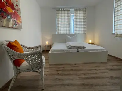 Ein Bett oder Betten in einem Zimmer der Unterkunft Weingärtner Appartements