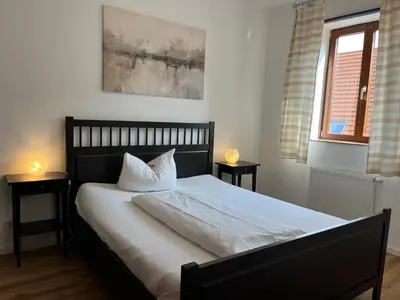 Ein Bett oder Betten in einem Zimmer der Unterkunft Weingärtner Appartements