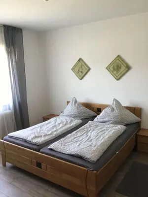 Ein Bett oder Betten in einem Zimmer der Unterkunft Ferienwohnung Bayrisch Nizza