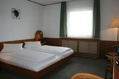 Ein Bett oder Betten in einem Zimmer der Unterkunft MyRooms - Margaretenhof