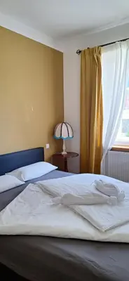Ein Bett oder Betten in einem Zimmer der Unterkunft Emmas