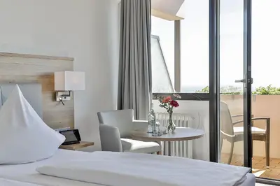 Ein Bett oder Betten in einem Zimmer der Unterkunft Arens Hotel 327mNN