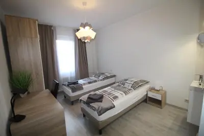 Ein Bett oder Betten in einem Zimmer der Unterkunft Aussicht Mainz-City - 4 Zimmer-max 7 Personen