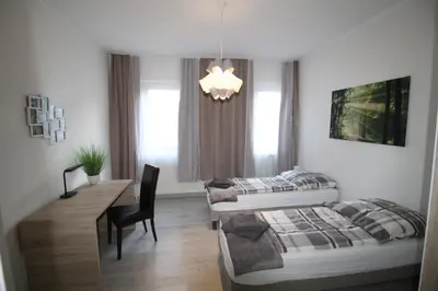 Ein Bett oder Betten in einem Zimmer der Unterkunft Aussicht Mainz-City - 4 Zimmer-max 7 Personen