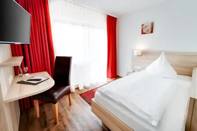 Ein Bett oder Betten in einem Zimmer der Unterkunft Hotel Waldparkstube