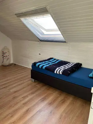 Ein Bett oder Betten in einem Zimmer der Unterkunft Gemütliche Monteur Ferienwohnung