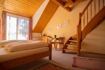 Ein Bett oder Betten in einem Zimmer der Unterkunft Gästehaus Hellmer