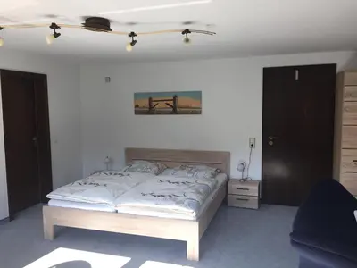 Ein Bett oder Betten in einem Zimmer der Unterkunft Ferienwohnungen Tauscher