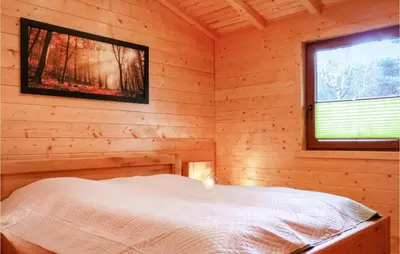 Ein Bett oder Betten in einem Zimmer der Unterkunft Lovely Home In Merzalben With Wifi