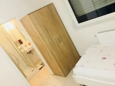 Ein Bett oder Betten in einem Zimmer der Unterkunft China-Restaurant Lin Garden