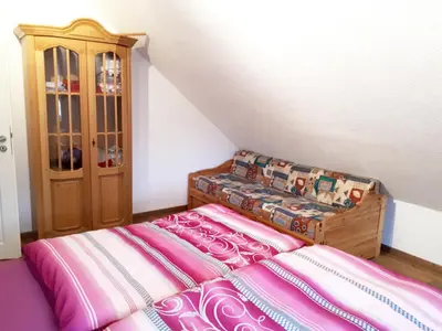 Ein Bett oder Betten in einem Zimmer der Unterkunft Ferienwohnung Farrenkopf