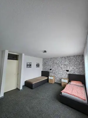 Ein Bett oder Betten in einem Zimmer der Unterkunft Kompfort Business Apartment
