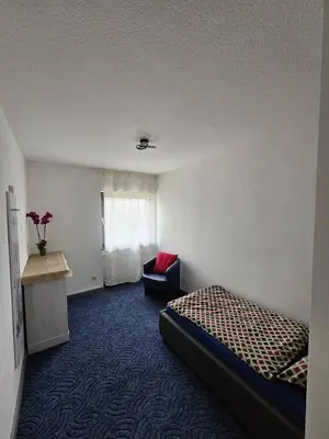 Ein Bett oder Betten in einem Zimmer der Unterkunft Kompfort Business Apartment