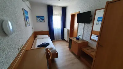 Ein Bett oder Betten in einem Zimmer der Unterkunft Prestige Bistro & Pension