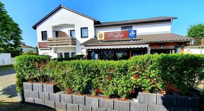 Ein Garten an der Unterkunft Prestige Bistro & Pension