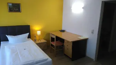 Ein Bett oder Betten in einem Zimmer der Unterkunft Hotel Arheilger Hof