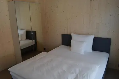Ein Bett oder Betten in einem Zimmer der Unterkunft New Age Boardinghaus N70