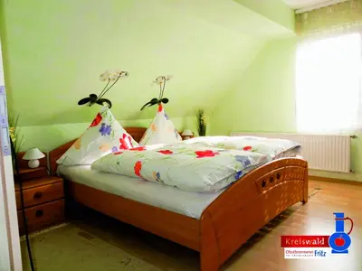 Ein Bett oder Betten in einem Zimmer der Unterkunft Ferienwohnung Edelbrenner