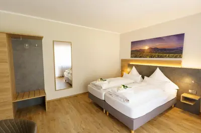 Ein Bett oder Betten in einem Zimmer der Unterkunft Pension Bergterrasse