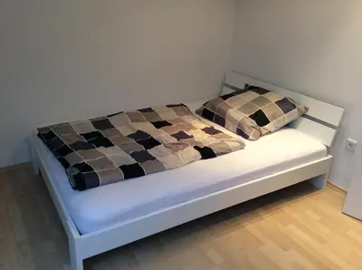 Ein Bett oder Betten in einem Zimmer der Unterkunft Ferienwohnung Heddesheim
