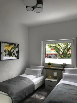 Ein Bett oder Betten in einem Zimmer der Unterkunft xxl Apartment Sinsheim