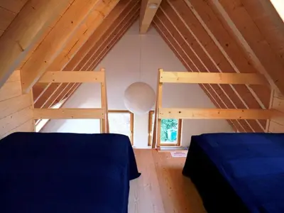 Ein Bett oder Betten in einem Zimmer der Unterkunft Ferienhaus In der Erlebach