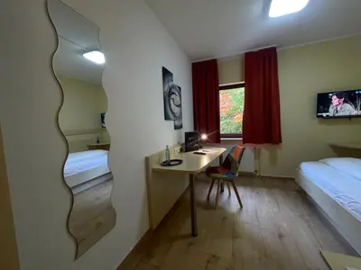 Ein Bett oder Betten in einem Zimmer der Unterkunft Hotel Waldesruh