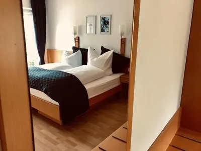 Ein Bett oder Betten in einem Zimmer der Unterkunft Am Landhaus - Gästezimmer