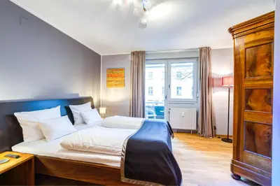 Ein Bett oder Betten in einem Zimmer der Unterkunft Qube Hotel Bergheim