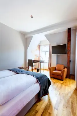 Ein Bett oder Betten in einem Zimmer der Unterkunft Qube Hotel Bergheim