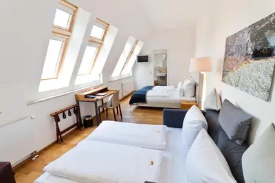 Ein Bett oder Betten in einem Zimmer der Unterkunft Qube Hotel Bergheim