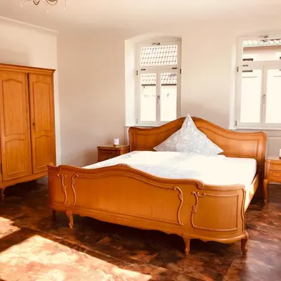 Ein Bett oder Betten in einem Zimmer der Unterkunft Barocker Hof Rhodt