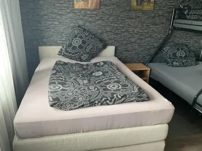 Ein Bett oder Betten in einem Zimmer der Unterkunft Bayrisch Nizza