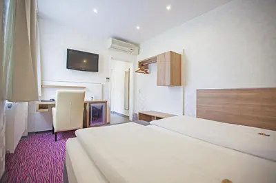 Ein Bett oder Betten in einem Zimmer der Unterkunft Am Bismarck