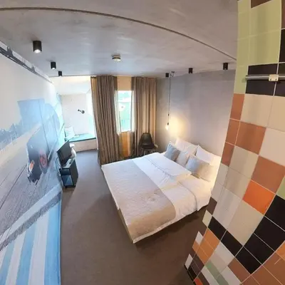 Ein Bett oder Betten in einem Zimmer der Unterkunft elferrooms Hotel