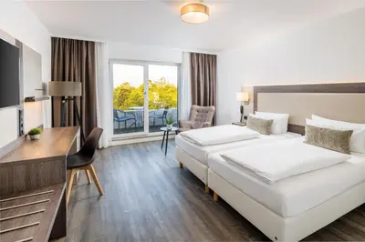 Ein Bett oder Betten in einem Zimmer der Unterkunft Hotel Newton Ludwigshafen