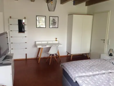 Ein Bett oder Betten in einem Zimmer der Unterkunft Gscheidles Ferienwohnung 40 munterm Haigern Talheim