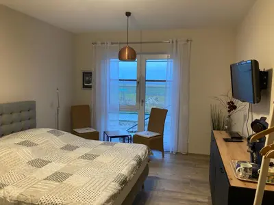 Ein Bett oder Betten in einem Zimmer der Unterkunft Doppelzimmer mit Ausblick