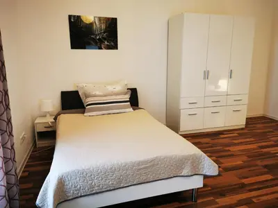 Ein Bett oder Betten in einem Zimmer der Unterkunft Ferienwohnung am Waldpfad