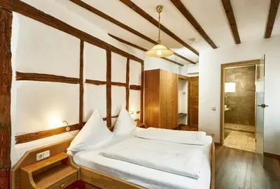Ein Bett oder Betten in einem Zimmer der Unterkunft Gasthof Zum Lam