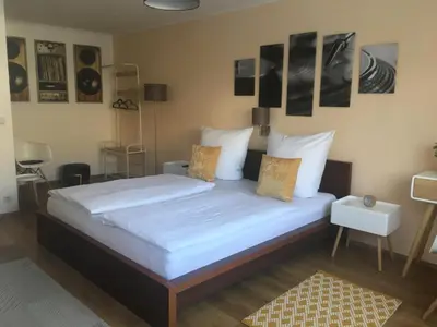 Ein Bett oder Betten in einem Zimmer der Unterkunft Hotel am Hafen