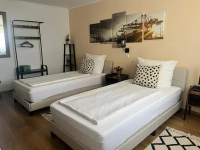 Ein Bett oder Betten in einem Zimmer der Unterkunft Hotel am Hafen