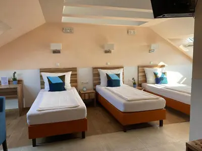 Ein Bett oder Betten in einem Zimmer der Unterkunft Hotel am Hafen